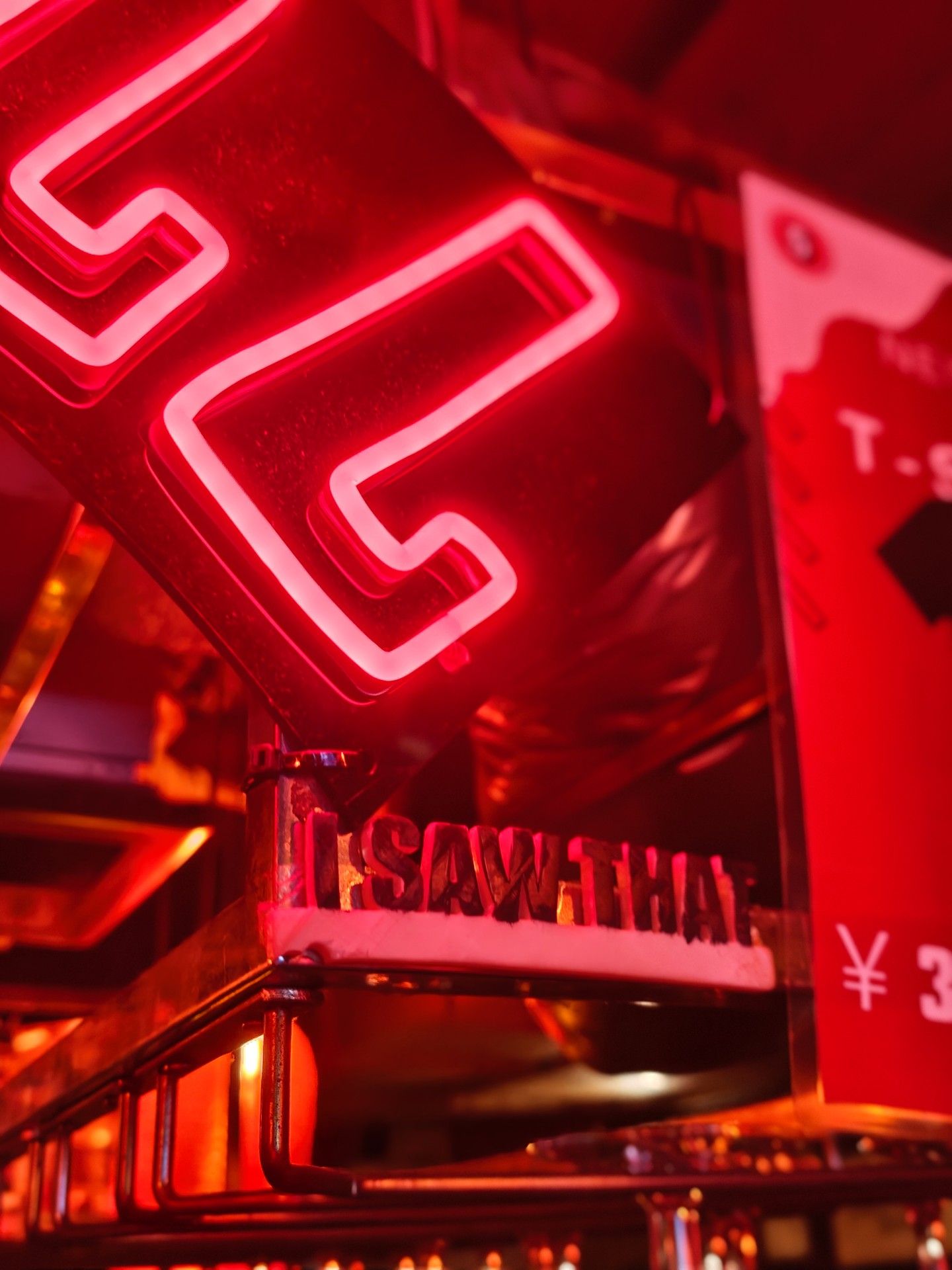 Red neon sign glowing above the bar